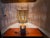 A bulb-shaped, openwork glazed ceramic lamp, finely decorated with colored cabochons. The lampshade has been remade to the...