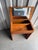 A Danish Modern teak vanity desk by EAEVA Co., marked "Made in Denmark 258" inside. The hinged top lifts to reveal a...