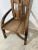 This is a striking, handmade, rustic wooden chair with the following features: • Design: The chair has a unique, organic...