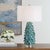 The Mina Table Lamp Showcases A Ceramic Base Meticulously Formed With Individual, Flowing Leaves, Finished With A...