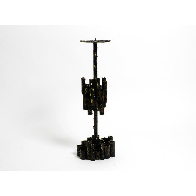Large 1950s heavy sculptural brutalist iron candlestick by Marcello Fantoni. Made in Italy. Great sculptural design made...