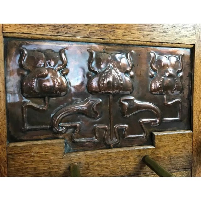 A beautiful Arts & Crafts period umbrella or stick stand by Shapland & Petter of Barnstaple, England, circa 1900. Crafted...