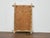 A Midcentury bleached bamboo mirror with clean lines and a laid-back presence. The frame’s natural bamboo has been...