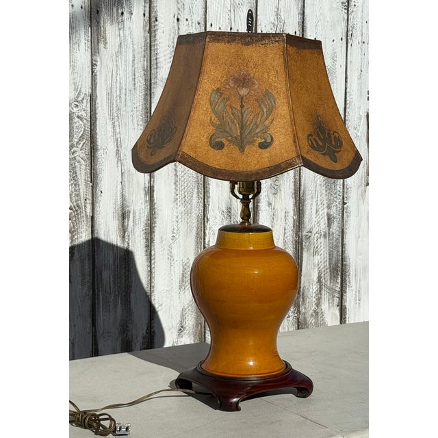 Vintage Chinese Eggyolk Colored Vase with a Terra Cotta Hand-Painted Parchment shade. This striking lamp features a warm...