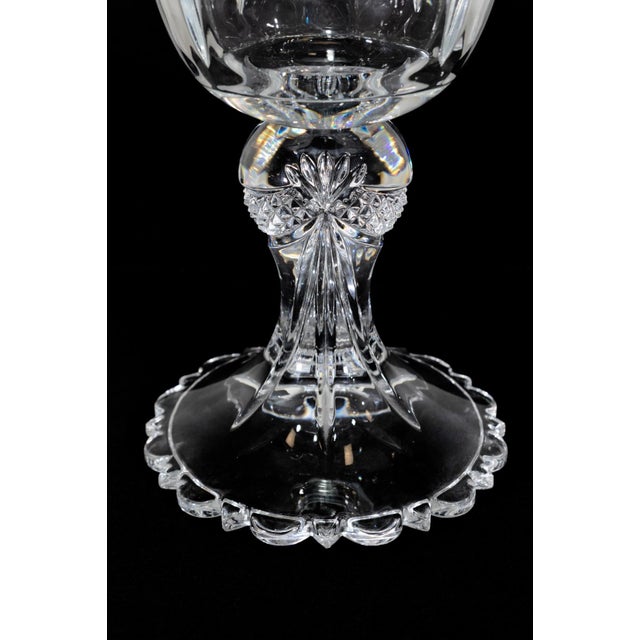 An elegant crystal vase by Towle, dating to the 1970s, showcasing the brand's tradition of fine American glassmaking. The...