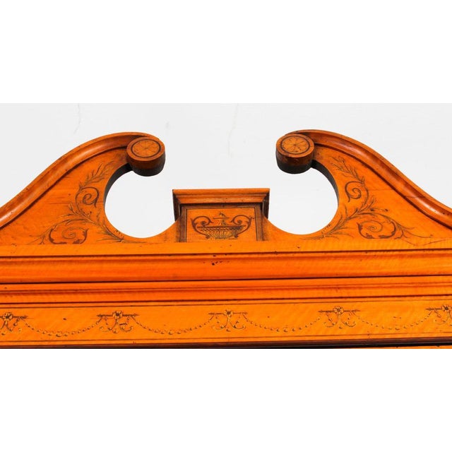 This is a beautiful antique Sheraton Revival top quality three door breakfront bookcase, masterfully crafted in rich...