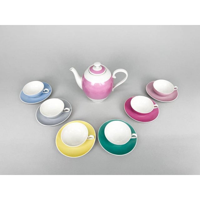 A rare set of a teapot and six cups and saucers made of fine Moser porcelain in beautiful pastel colours. Made in...