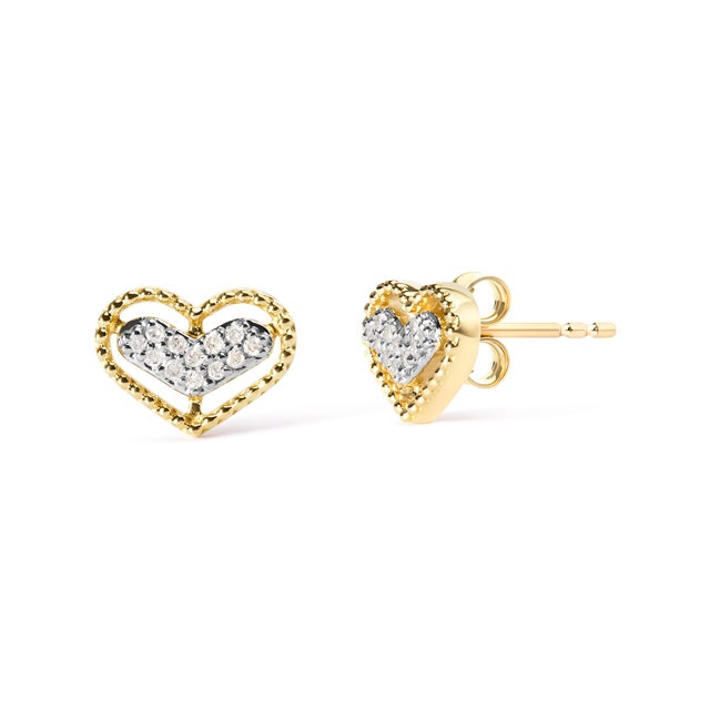 Step into the essence of elegance with these heart-shaped stud earrings, masterfully crafted in resplendent 10K yellow...