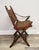 A pair of folding campaign chairs in faux bamboo hardwood — believed to be teak with original herringbone wicker seats and...
