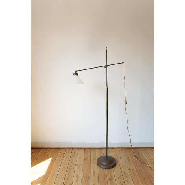 Vintage Floor Lamp in Brass and Glass, in Worn conditions. Designed 1970 to 1979 European Plug (up to 250V).The wiring of...