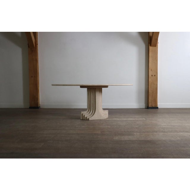 Fantastic dining table model Argo in travertine, designed by Carlo Scarpa for the “Ultrarazionale” collection, produced...