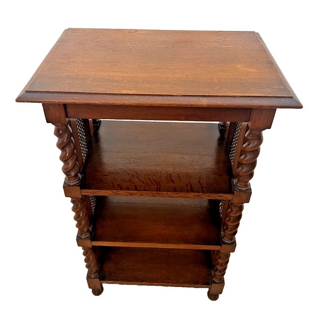 Add a touch of timeless European charm to your home with this gorgeous Antique Oak 4-Tier Etagere Bookcase. Featuring...