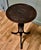 This lovely table stands on a very unusual three footed leg it has an exquisitely turned and split centre column with the...