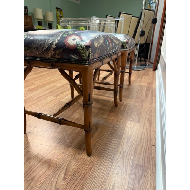 Elegant Pair of Vintage Faux Bamboo Ottomans in Clarence House 'Souvenir d'Afrique' Style Fabric Bring a touch of...