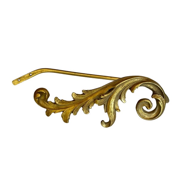 Beautifully carved Italian plaster scrolling acanthus leaf-form tiebacks are perfectly finished in warm aged gilt.
