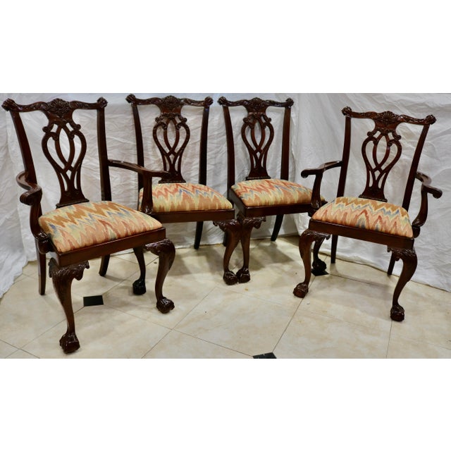 Chippendale Hand Carved Mahogany Dining Chairs -Set of 8. The chairs feature Lion's main legs, Ball & Claw feet,...