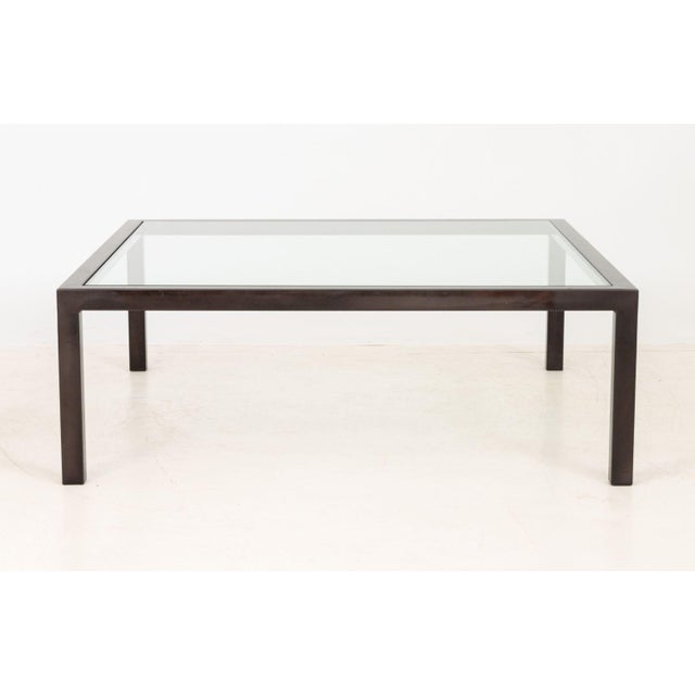 Modern Polished Metal and Glass Top Coffee Table. 18" H x 52" W x 52" D. Provenance: From a 45 Sutton Place South Estate.
