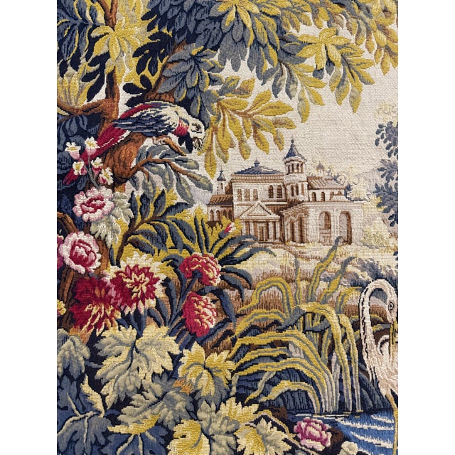 A romantic pastoral scene woven in the traditional French verdure style. This richly detailed tapestry features lush...