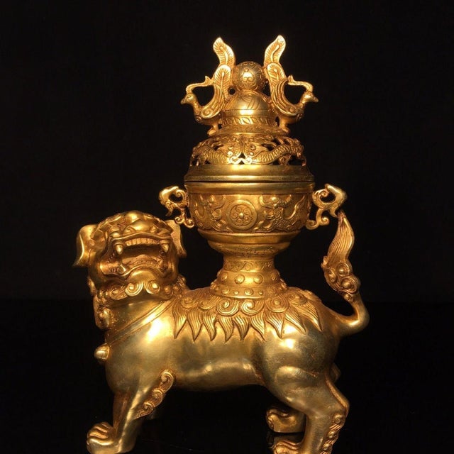 This is a striking vintage Chinese incense burner (censer) featuring a detailed Foo Dog (Buddhist Lion) supporting a...