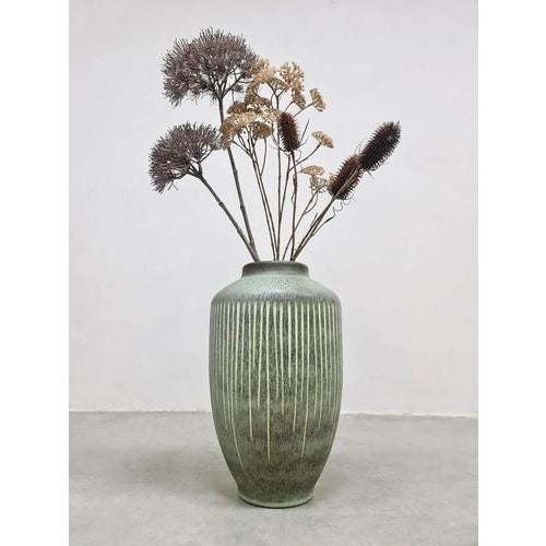 Vase-tastic… this amazing vintage ceramic vase from Steuler! This special piece in a beautiful soft green shade is a...