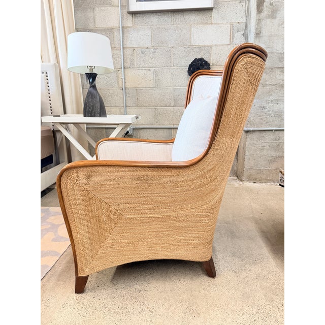 The Kingston Wing Chair has a hardwood frame and tapered legs with a warm natural finish, accented by sculptural natural...