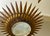 Large Spanish sunburst light in gilt metal and frosted glass, green, white, orange, other color Spain, 1950s. Midcentury...