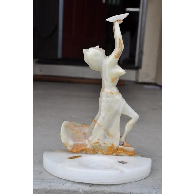 (YOU CAN MAKE REASONABLE OFFERS). The sculpture depicts a woman holding a bowl or plate with her hands high above her. It...