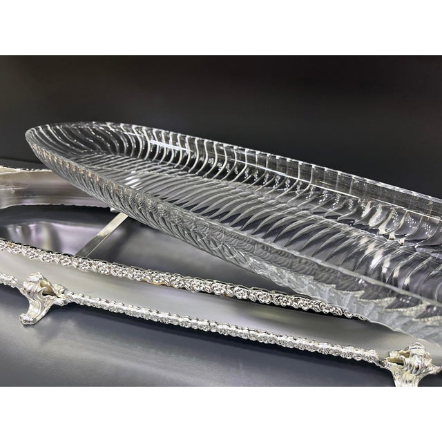 Serve your favorite dishes in style with this elegant set of 2 oval brass serving trays with handles. Each tray features a...