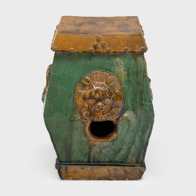 This low, ceramic garden drum is drip glazed in the manner of ancient Chinese sancai ware, cloaked in luminous shades of...