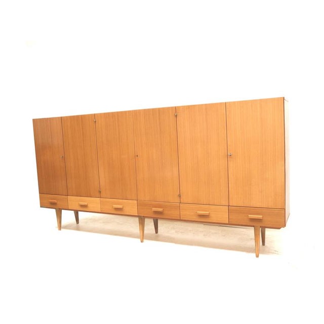 XXL vintage highboard / tall sideboard from the 1970s. This XXL vintage highboard from the 1970s is a practical choice for...