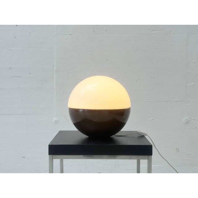 A distinctive table lamp by alvino bagni from the 1970s. With its round, almost spherical shape, it is a typical example...