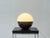 A distinctive table lamp by alvino bagni from the 1970s. With its round, almost spherical shape, it is a typical example...