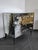 An elegant Venetian commode entirely clad in engraved mirrors, this piece combines refinement and luminosity in a...
