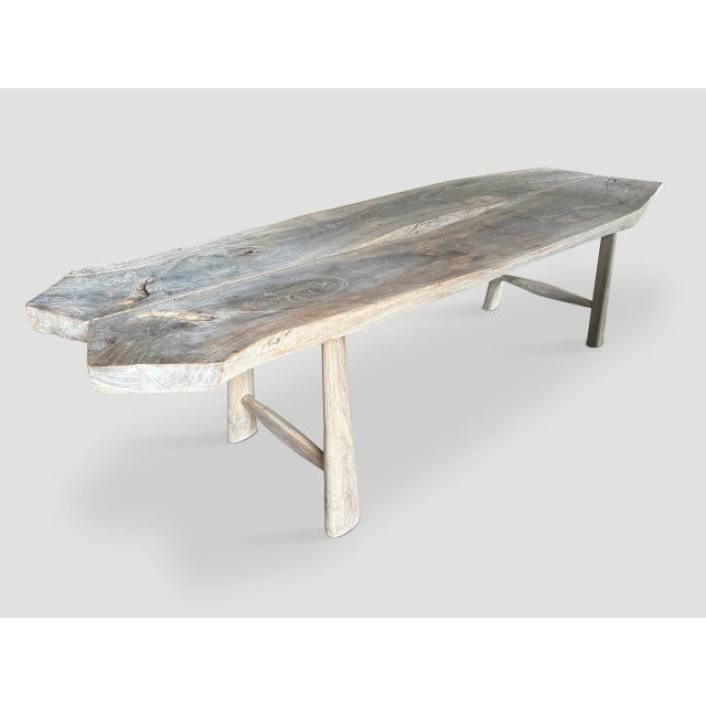 An impressive five inch slab of teak wood was sliced into two pieces and placed together to produce this one of a kind...