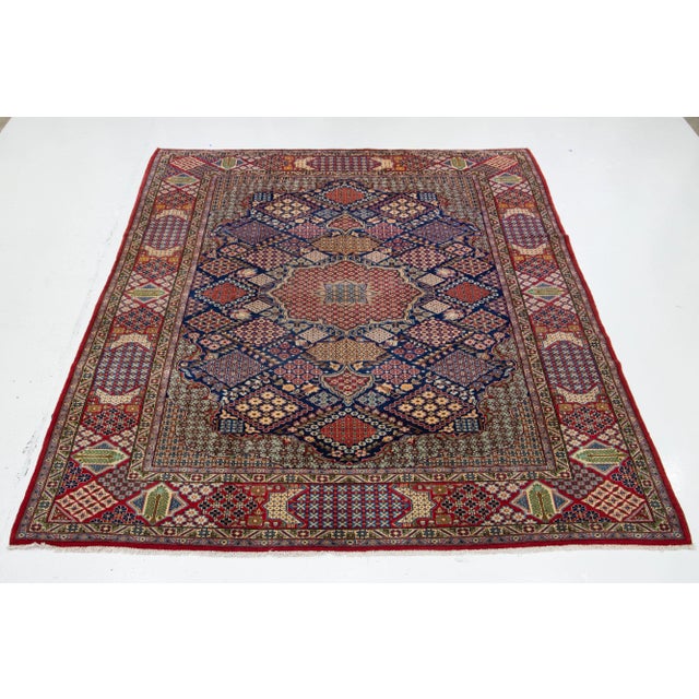 Beautiful vintage Kashan Persian wool rug with a navy blue field. This rug has an all-over design accentuated with...