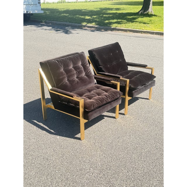 A pair by ‘Worlds Away’ used for staging. Gold leaf frame with black tufted velvet cushions. Highly comfortable, really...