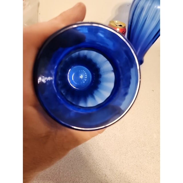 Beautiful pair of vintage Fenton Art Glass vases in a striking cobalt blue color. These elegant melon-shaped vases feature...