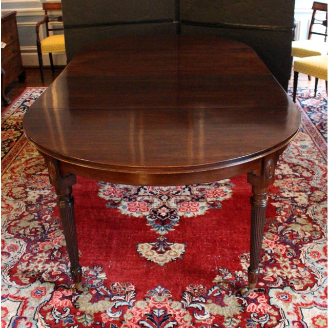 Circa 1880 round extending Regency Revival dining table, English. Of the finest mahogany timbers. 2 leaves - 23.75" &...