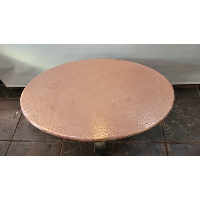A heavy duty copper hand hammered coffee table Nice handmade detailing.