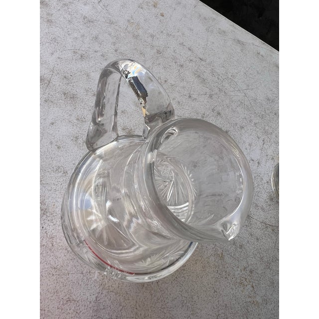 This stunning vintage mid-century cut-crystal pitcher features an intricate, deeply carved Pinwheel and Hobstar pattern...