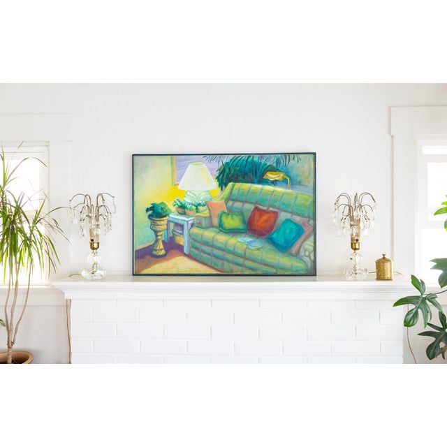 A large and vibrant oil painting of a cozy couch nook in a living room, done in a fauvist style, is signed Henson at the...