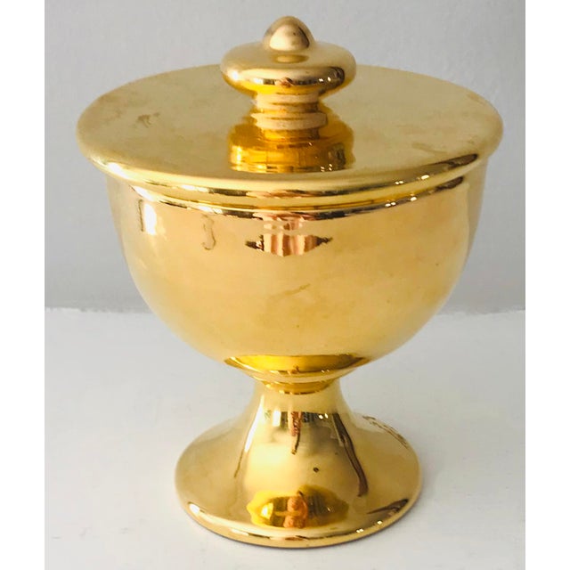 Mid 20th C gold coated ceramic candy or trinket dish with pedestal base. Lidded. This beautiful dish will be perfect in...