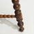 A 20th century stool crafted in oak, featuring a traditional bobbin-turned leg structure. The design emphasizes...