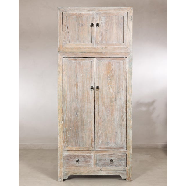 This vintage Chinese compound cabinet features a classic two-piece configuration, offering generous storage while...