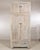This vintage Chinese compound cabinet features a classic two-piece configuration, offering generous storage while...