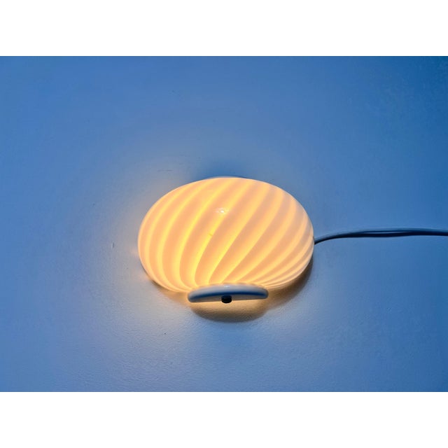 These exquisite wall lamps, crafted in Italy during the 1960s, are made entirely of glass, showcasing a modern design...