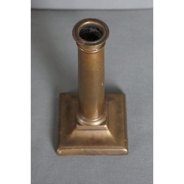 A very elegant Empire Taafelkandelaar of copper from the beginning of the 19th century. This beautiful antique Empire...