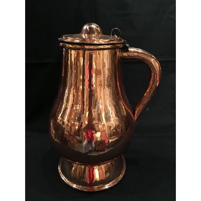 French polished copper jug or pitcher with lid and handle, 19th century.