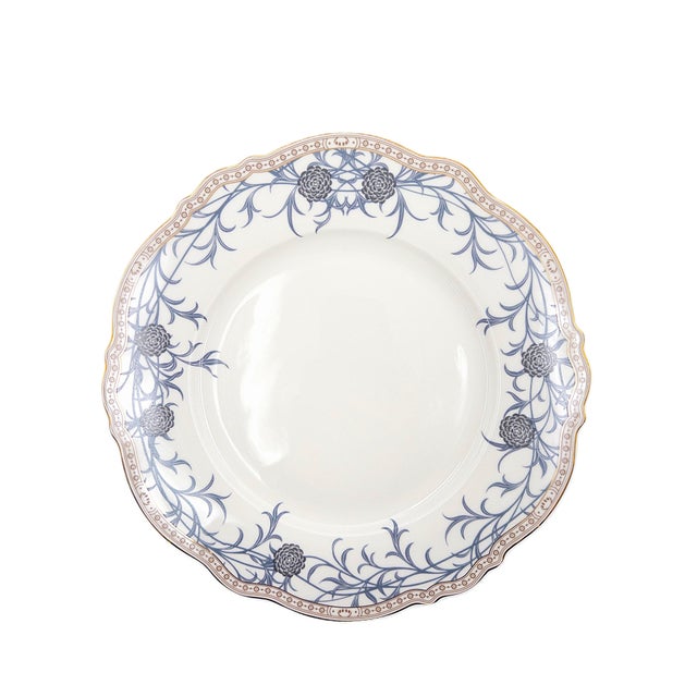 Elevate your table with this elegant set of four porcelain dinner plates inspired by the timeless botanical artistry of...