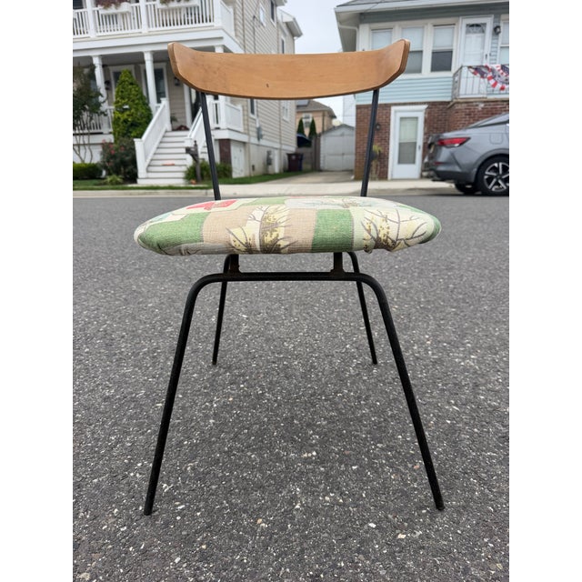Mid century atomic age chair by Clifford Pascoe. The chair features a bentwood backrest with a wrought iron base....